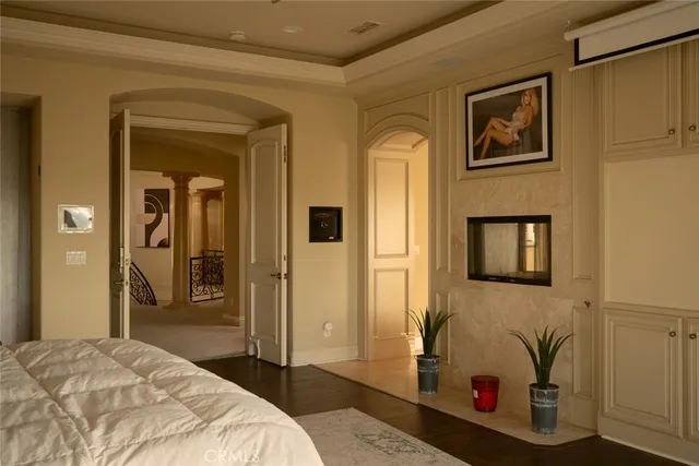 a bedroom with a bed and a cabinets