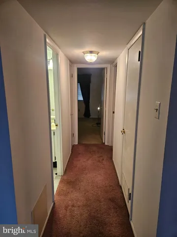 a bathroom with a toilet a sink and a mirror