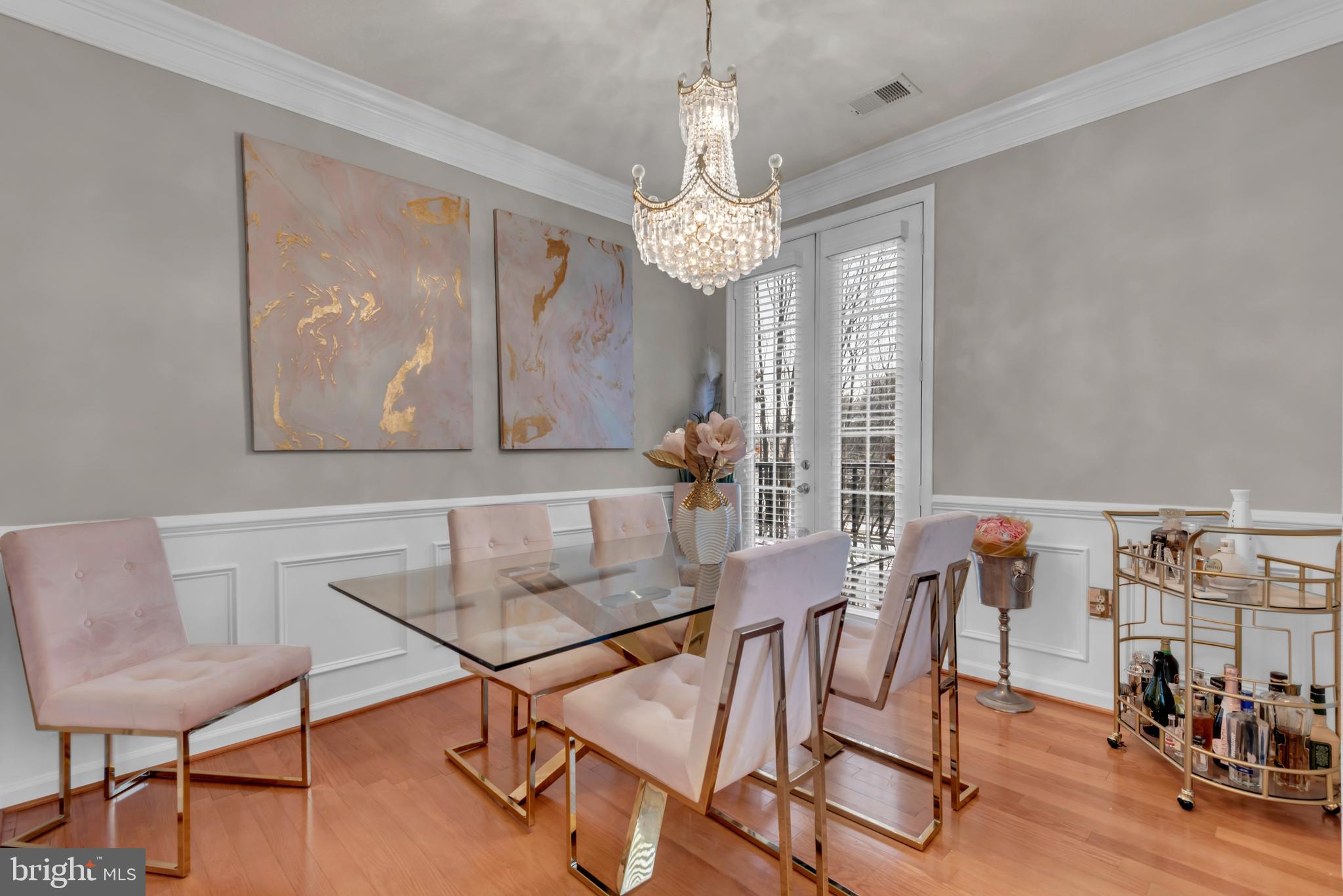 7 Booth Street, Unit 302 Gaithersburg, MD 20878 - Photo 11 of 63 a view of a dining room with furniture and chandelier