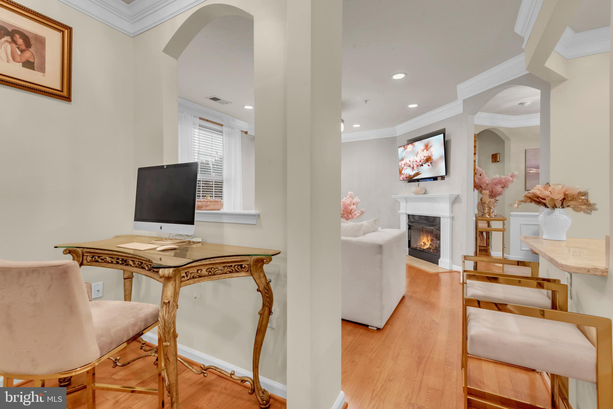 7 Booth Street, Unit 302 Gaithersburg, MD 20878 - Photo 12 of 63 a living room with furniture and a flat screen tv