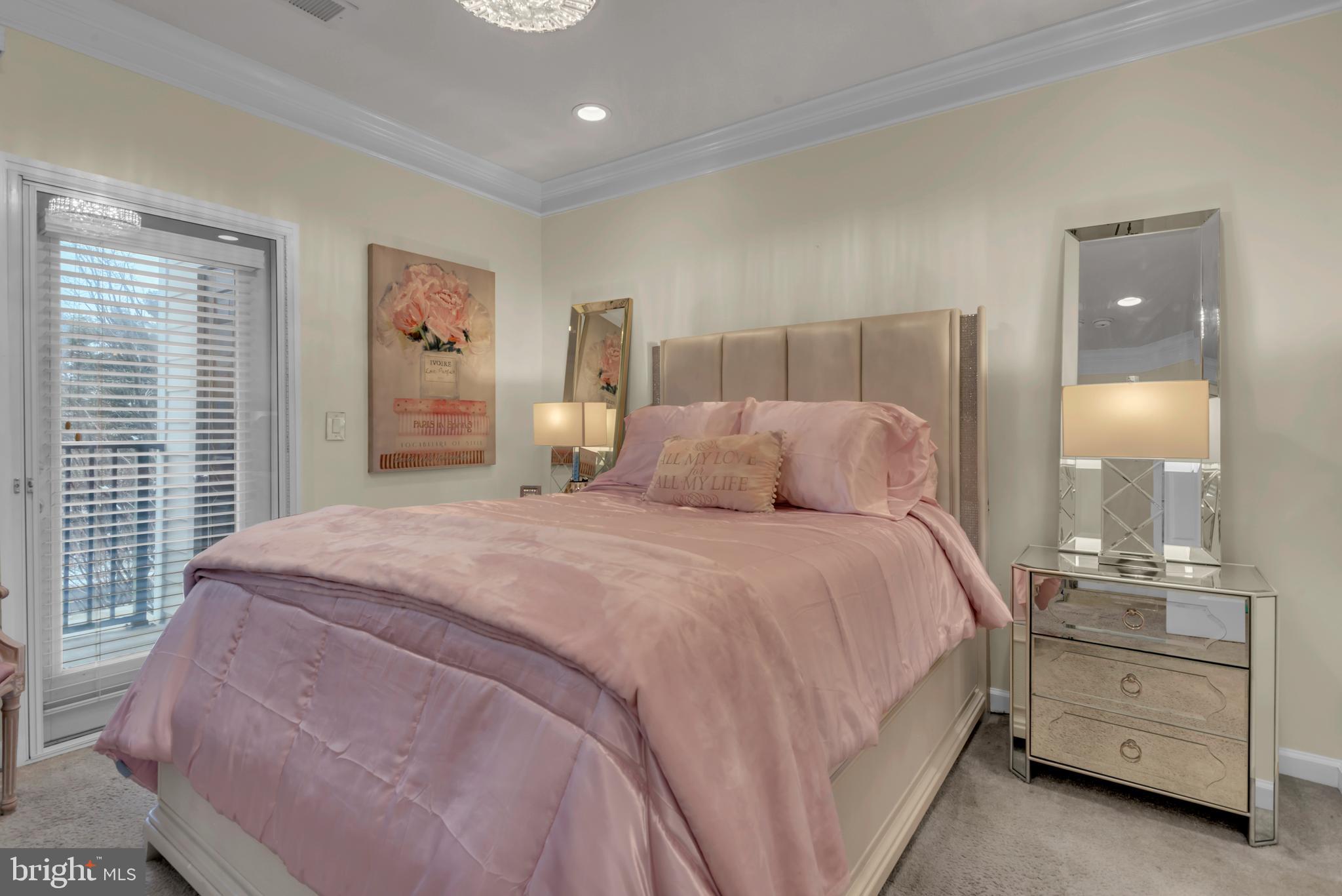 7 Booth Street, Unit 302 Gaithersburg, MD 20878 - Photo 19 of 63 a bedroom with a bed and a dresser