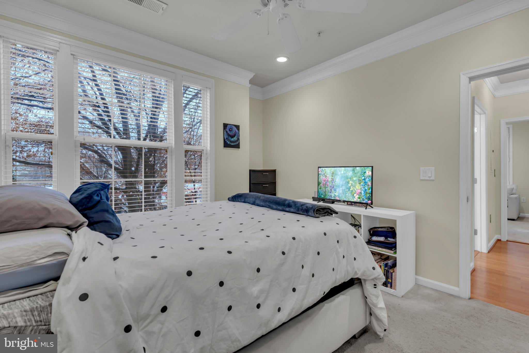 7 Booth Street, Unit 302 Gaithersburg, MD 20878 - Photo 27 of 63 a bedroom with a bed and wooden floor
