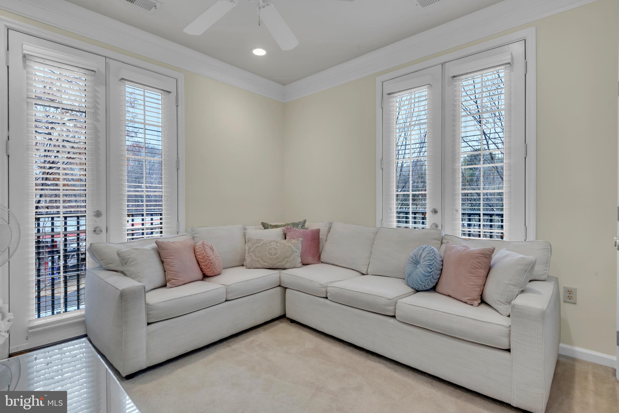 7 Booth Street, Unit 302 Gaithersburg, MD 20878 - Photo 29 of 63 a living room with furniture and windows
