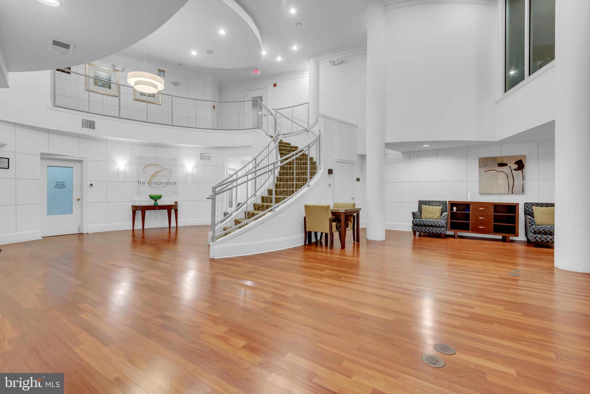7 Booth Street, Unit 302 Gaithersburg, MD 20878 - Photo 45 of 63 a view of a room with lots of wooden furniture and potted plants