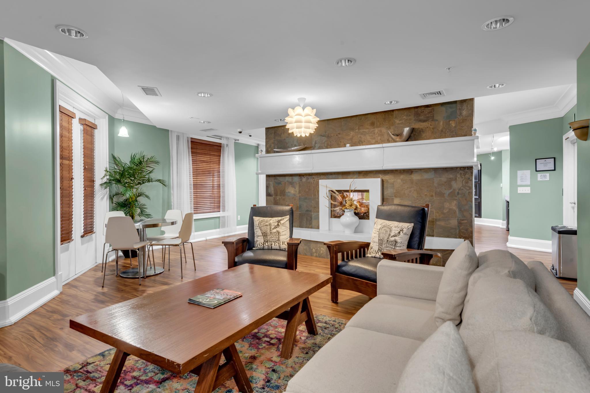 7 Booth Street, Unit 302 Gaithersburg, MD 20878 - Photo 56 of 63 a living room with furniture kitchen view and a table