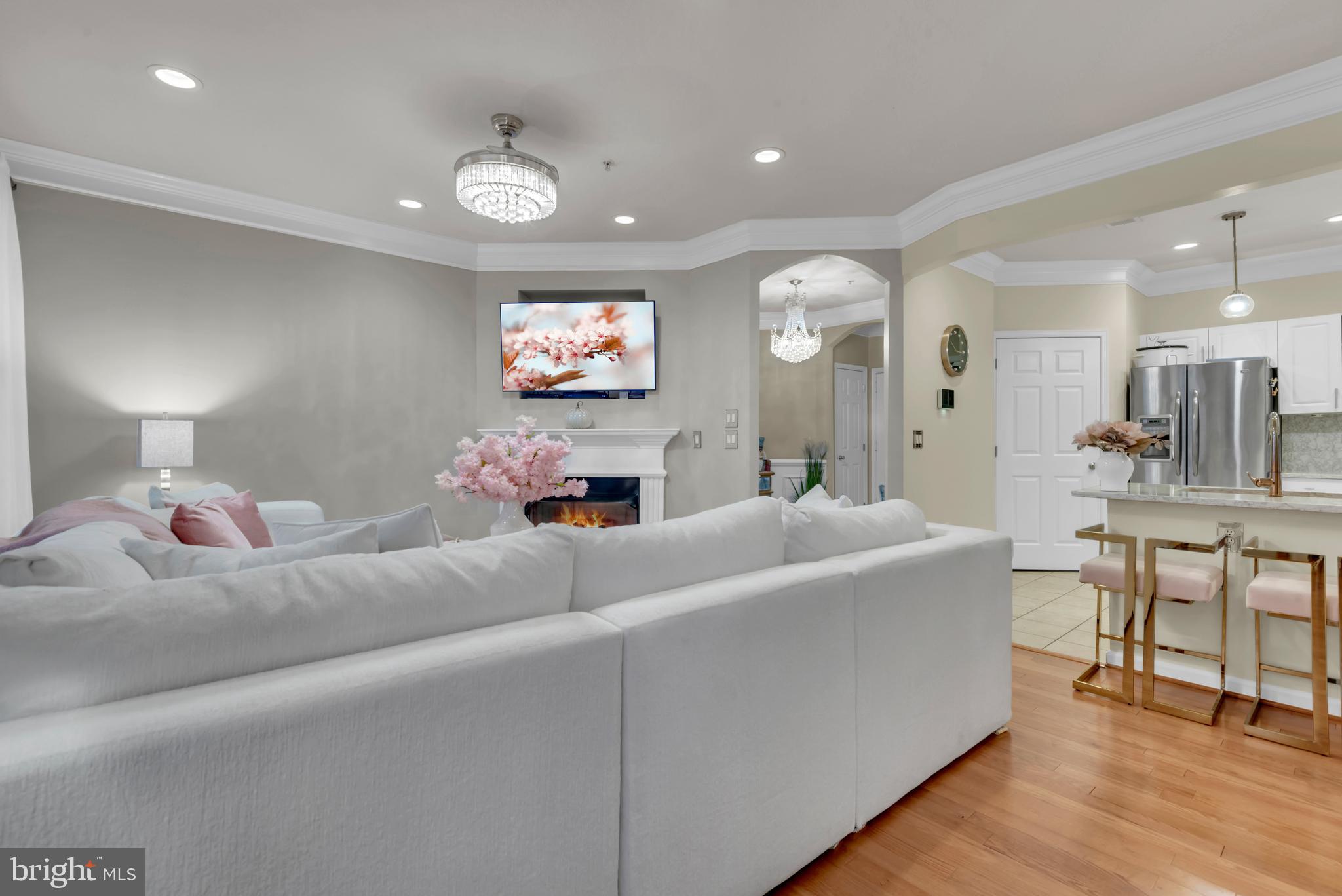 7 Booth Street, Unit 302 Gaithersburg, MD 20878 - Photo 10 of 63 a living room with furniture and a flat screen tv