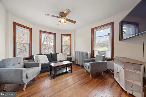 a living room with furniture and a large window