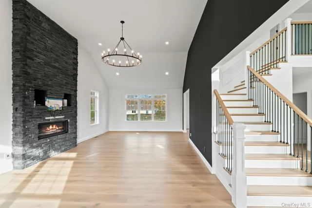 a view of an entryway with wooden floor