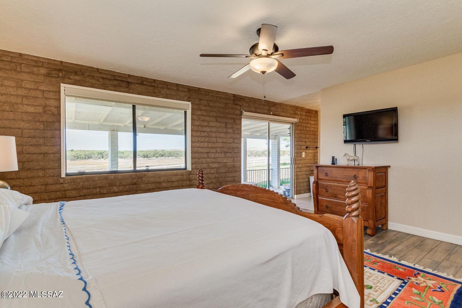 36645 South Arivaca Ranch Road Arivaca, AZ 85601 - Photo 18 of 49 a bedroom with a bed and a flat screen tv