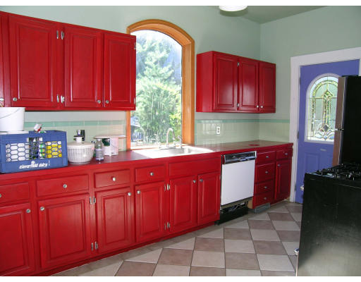 17 Union Avenue Boston, MA 02130 - Photo 6 of 11 a kitchen with stainless steel appliances granite countertop a stove cabinets and wooden floor