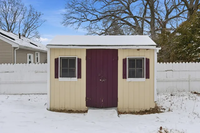 a view of a house with a tree