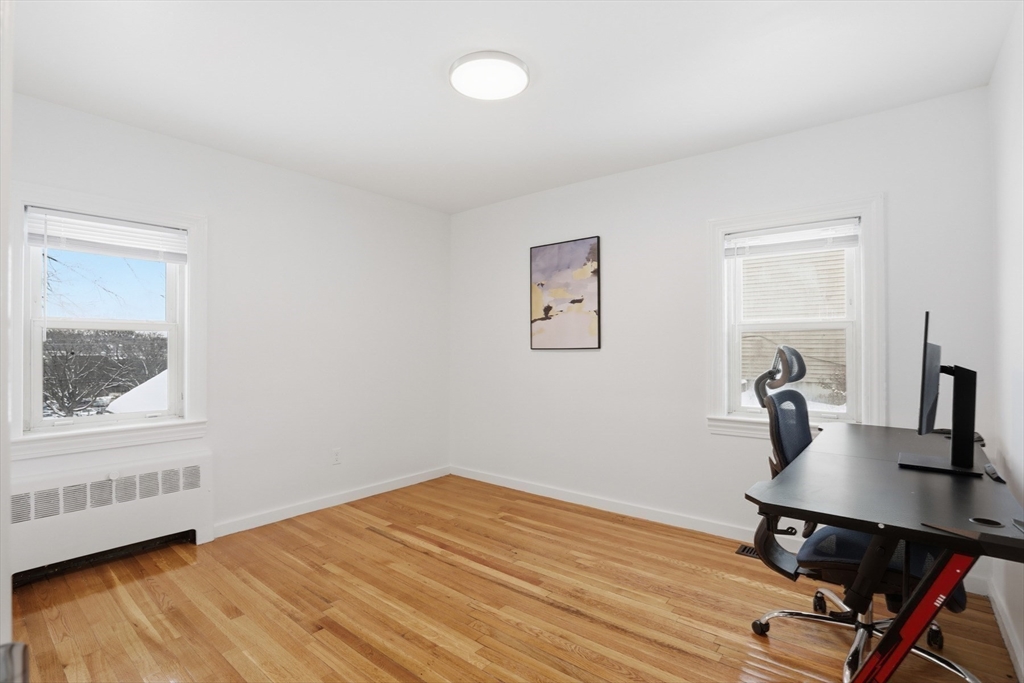 39 Phebe Avenue Lowell, MA 01854 - Photo 8 of 20 a workspace with wooden floor