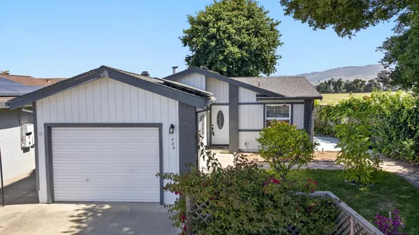 front view of a house with a small yard