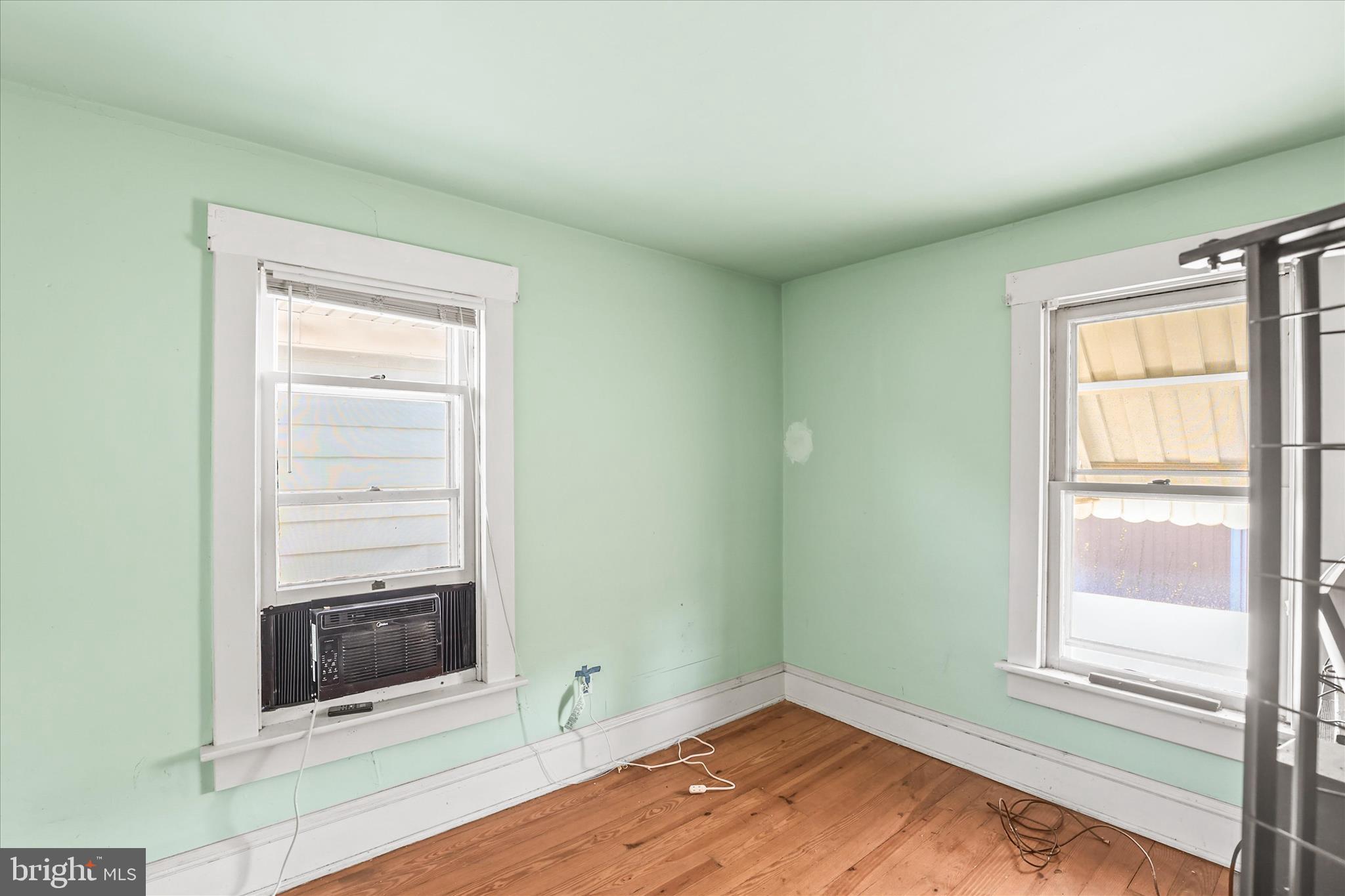 4 Penn Street Hanover, PA 17331 - Photo 14 of 28 a view of an empty room with wooden floor and a window
