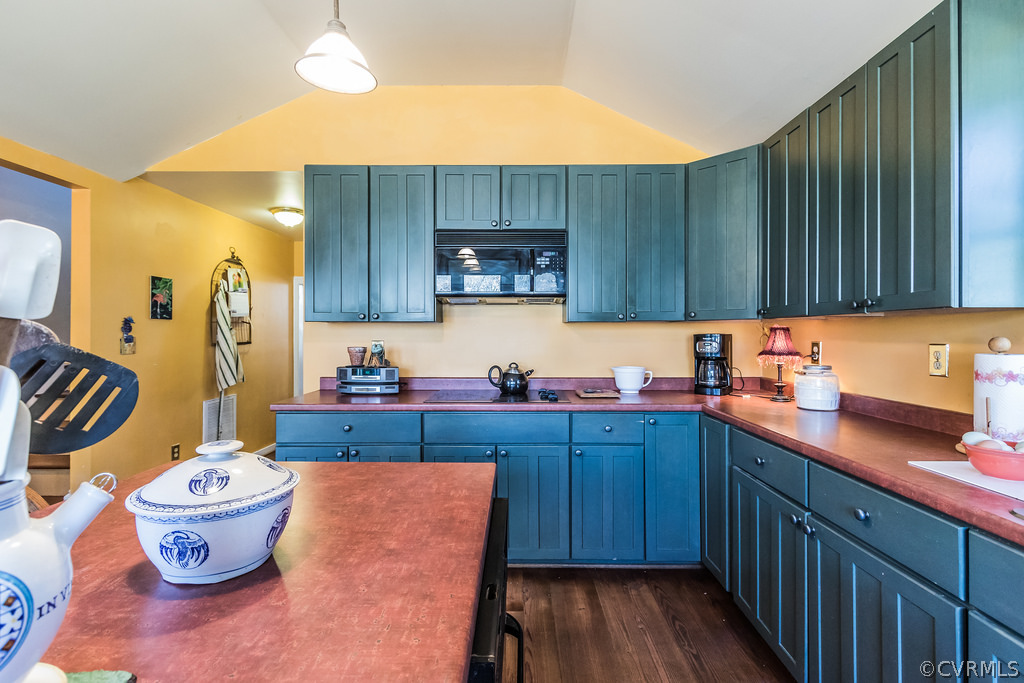 12016 Old Buckingham Road Midlothian, VA 23113 - Photo 13 of 24 a kitchen with a sink and wooden cabinets
