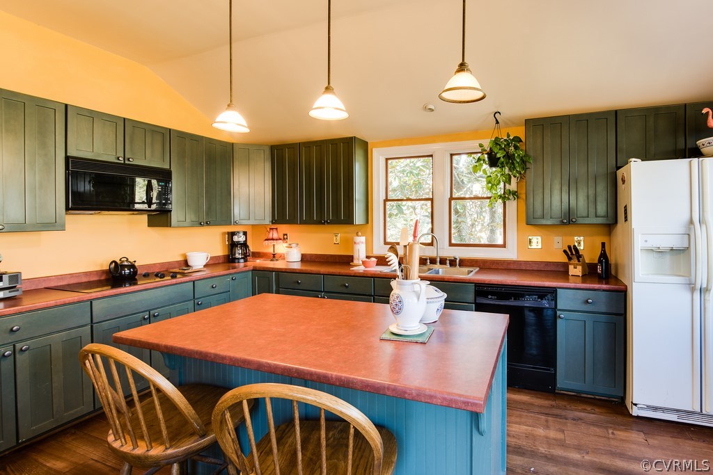 12016 Old Buckingham Road Midlothian, VA 23113 - Photo 16 of 24 a kitchen with stainless steel appliances sink microwave dining table and chairs