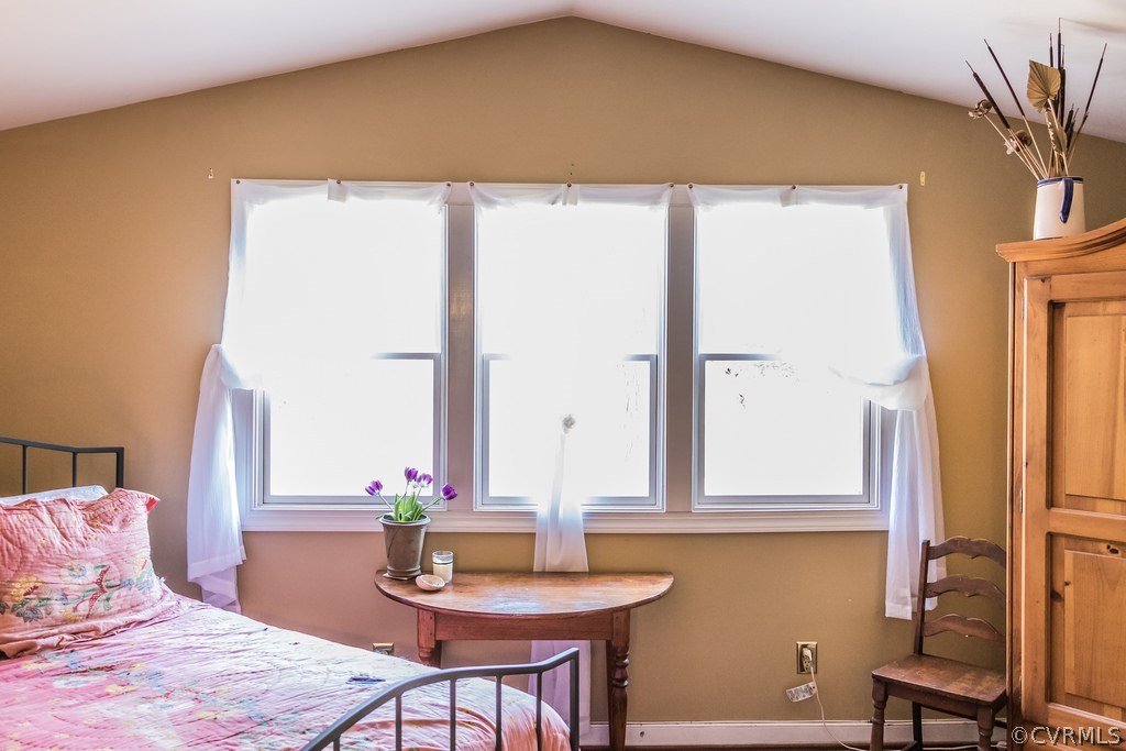 12016 Old Buckingham Road Midlothian, VA 23113 - Photo 19 of 24 a bedroom with a bed and a table in it