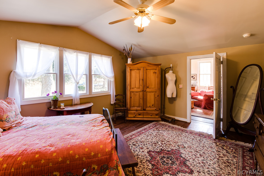 12016 Old Buckingham Road Midlothian, VA 23113 - Photo 20 of 24 a bed room with a bed a couch and a chandelier