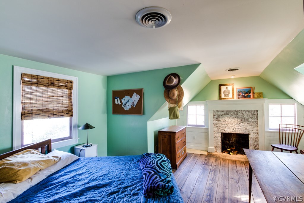 12016 Old Buckingham Road Midlothian, VA 23113 - Photo 21 of 24 a bedroom with furniture and a fireplace