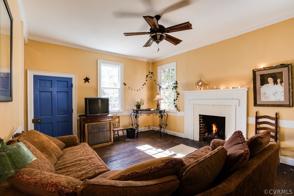 12016 Old Buckingham Road Midlothian, VA 23113 - Photo 5 of 24 a living room with furniture and a fireplace