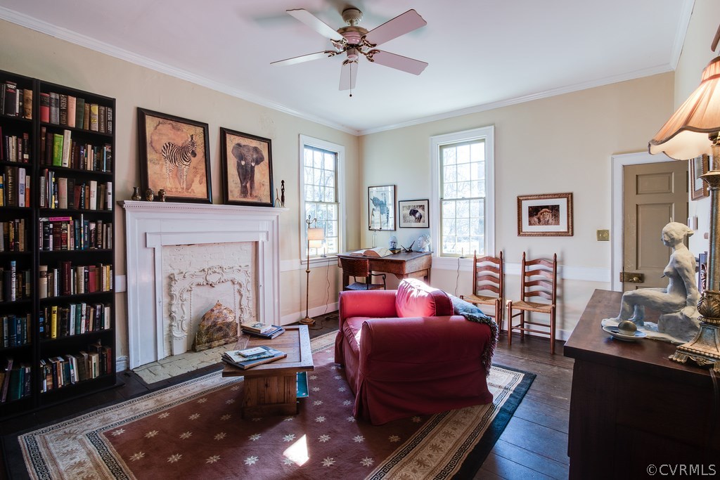 12016 Old Buckingham Road Midlothian, VA 23113 - Photo 8 of 24 a living room with furniture and a book shelf