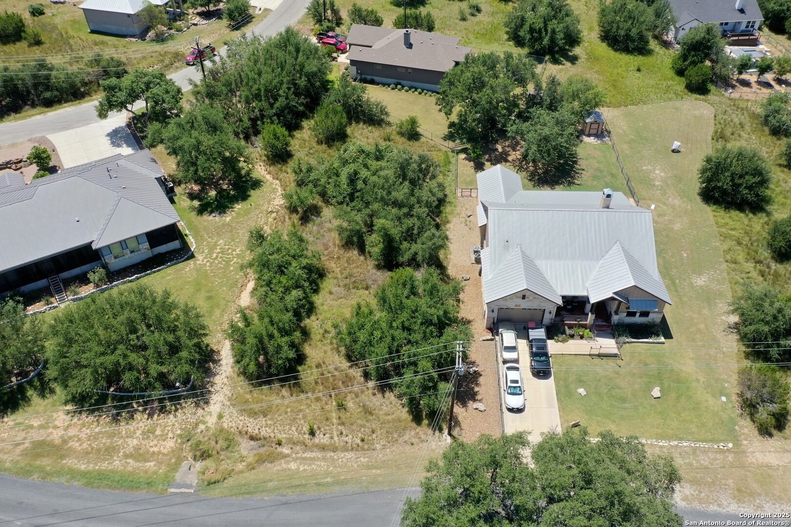 an aerial view of a house with yard swimming pool and outdoor seating