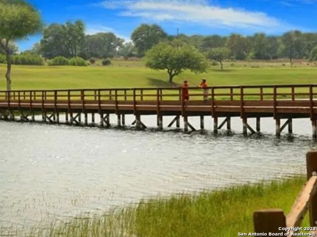a view of swimming pool with lake and mountain view