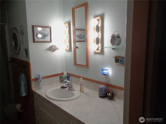 a bathroom with a sink and mirror