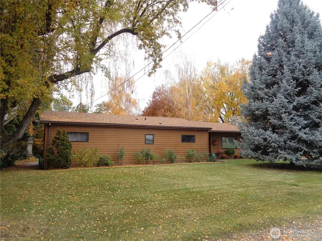 a view of house with outdoor space and garden