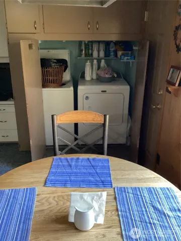 a room with pool table and wooden floor