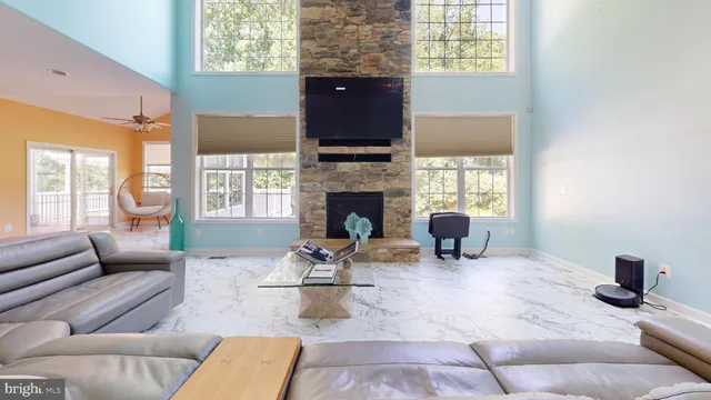 a view of a room with furniture and a chandelier