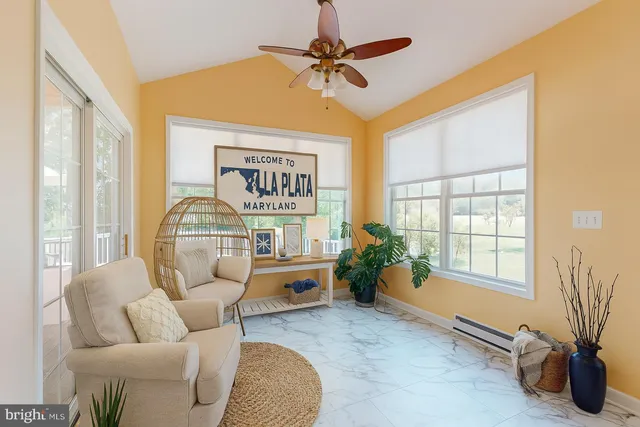 a view of a chair and table on the deck