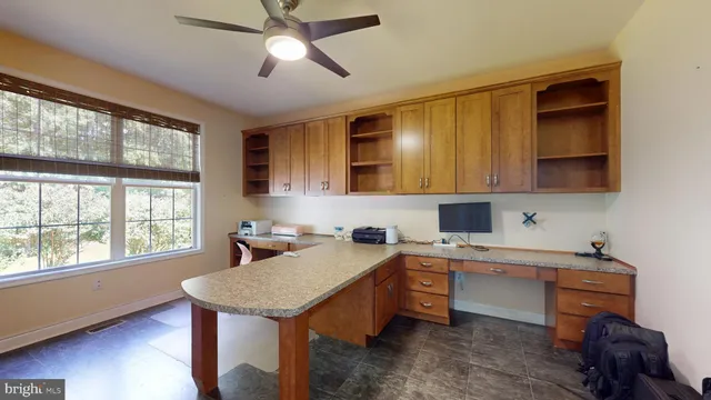 a view of a house with swimming pool and a yard