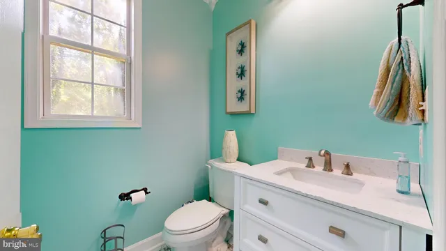 an aerial view of a house with a yard and outdoor seating