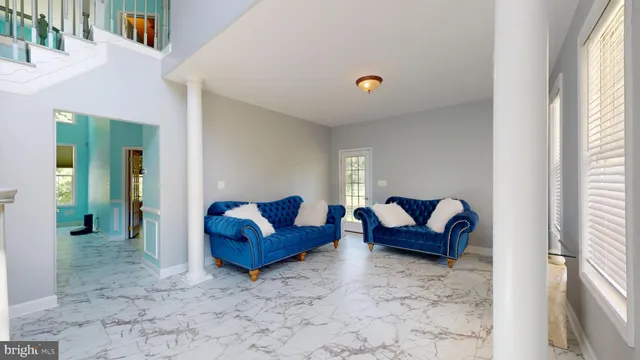 a living room with furniture fireplace and window