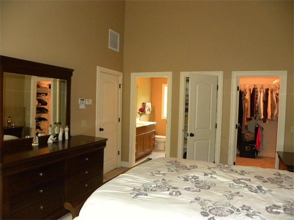 52 Baker Pond Road Charlton, MA 01507 - Photo 11 of 30 a bedroom with a bed and a mirror on dresser