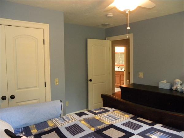 52 Baker Pond Road Charlton, MA 01507 - Photo 15 of 30 a bedroom with a bed and a lamp on dresser