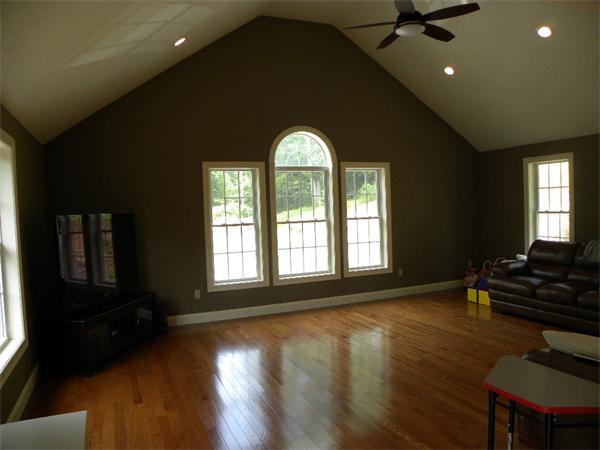 52 Baker Pond Road Charlton, MA 01507 - Photo 22 of 30 a view of empty room with wooden floor and fan