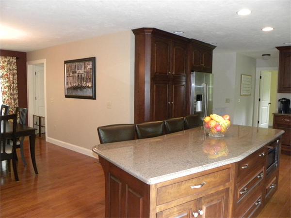 52 Baker Pond Road Charlton, MA 01507 - Photo 24 of 30 a kitchen with a table chairs and refrigerator