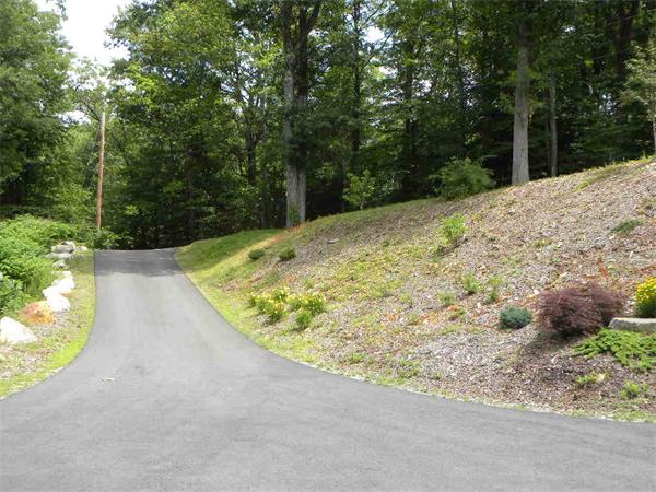 52 Baker Pond Road Charlton, MA 01507 - Photo 28 of 30 a view of a swimming pool with a yard