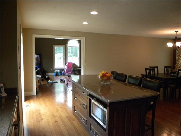 52 Baker Pond Road Charlton, MA 01507 - Photo 29 of 30 a living room with furniture and a wooden floor