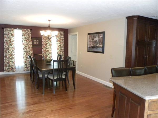 52 Baker Pond Road Charlton, MA 01507 - Photo 6 of 30 a view of a dining room with furniture and wooden floor