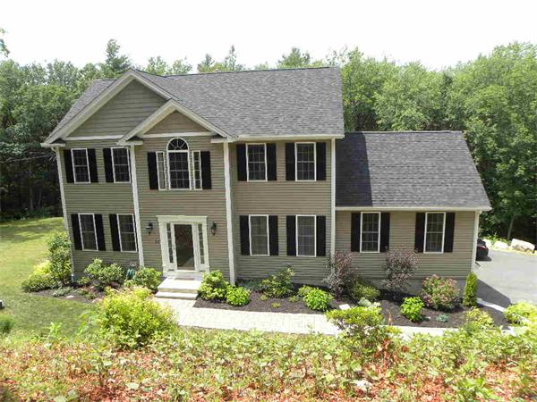 52 Baker Pond Road Charlton, MA 01507 - Photo 9 of 30 front view of a house with a yard