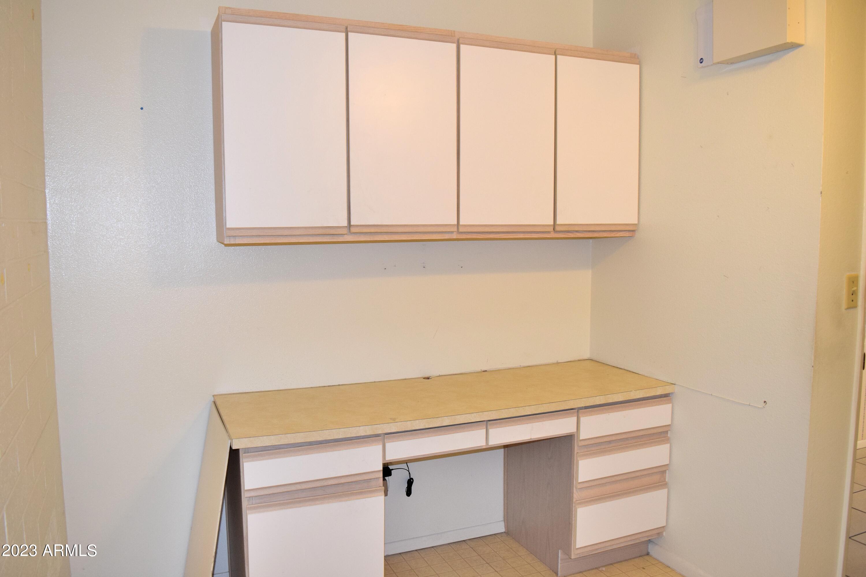 10705 West Hatcher Road Sun City, AZ 85351 - Photo 16 of 29 Desk in Utility Room