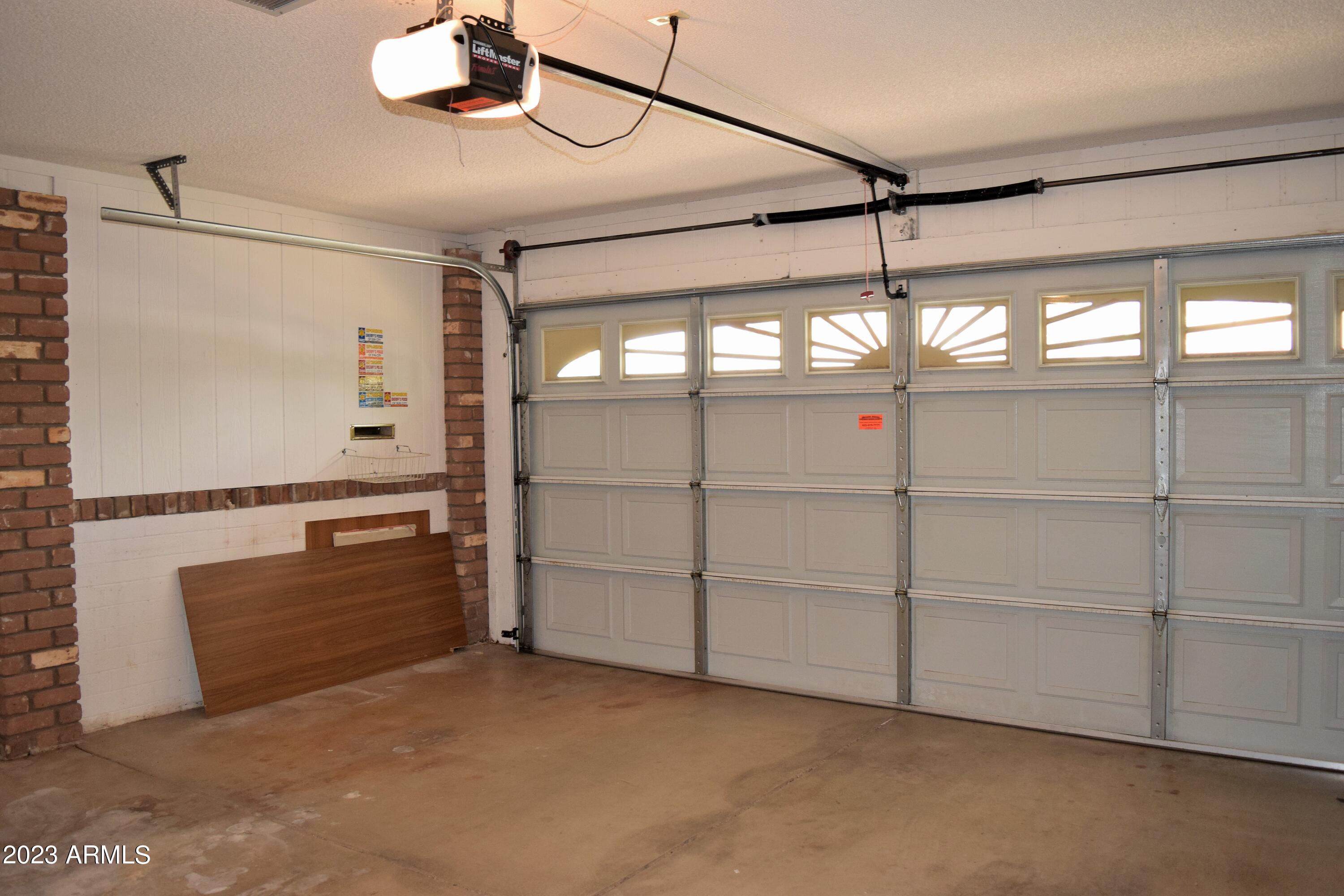 10705 West Hatcher Road Sun City, AZ 85351 - Photo 27 of 29 Newer Garage Door