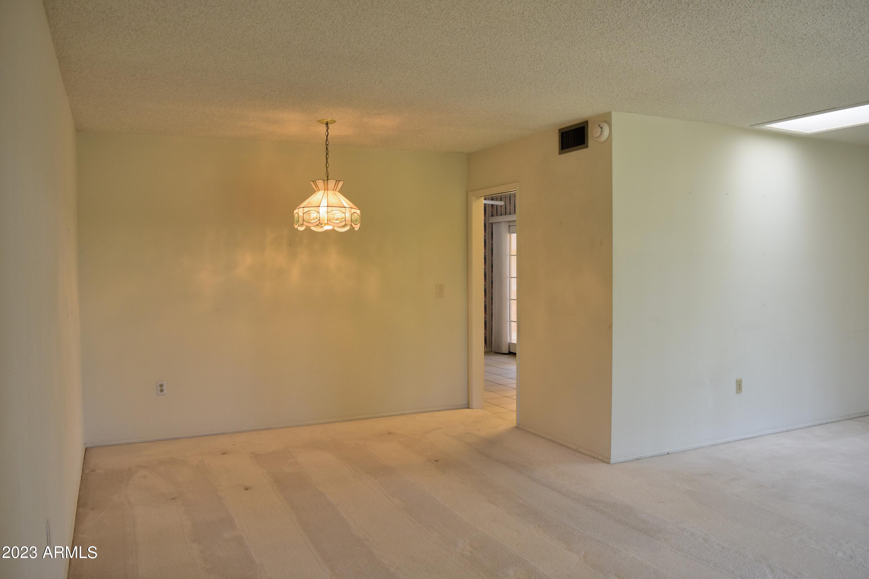 10705 West Hatcher Road Sun City, AZ 85351 - Photo 7 of 29 Living Room/Dining Room