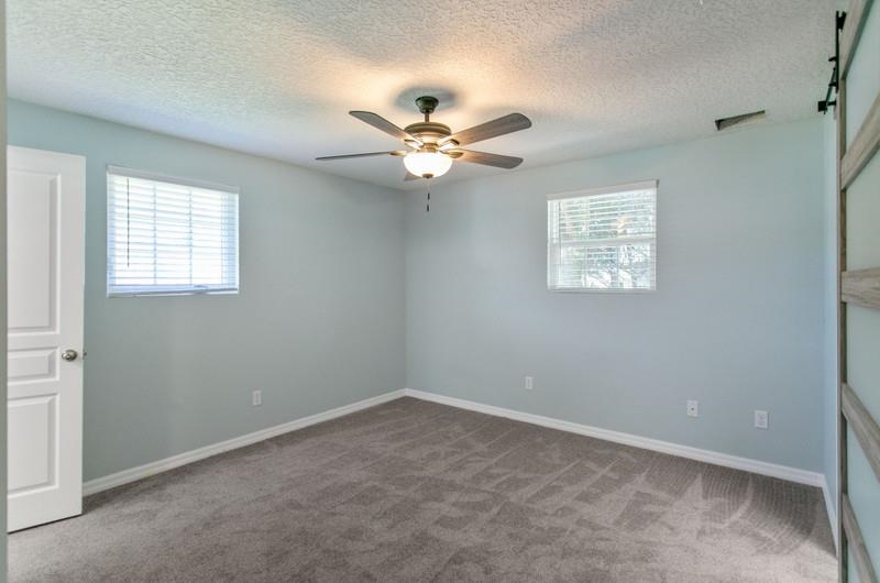 347 Lobelia Road St. Augustine, FL 32086 - Photo 13 of 40 an empty room with windows and fan