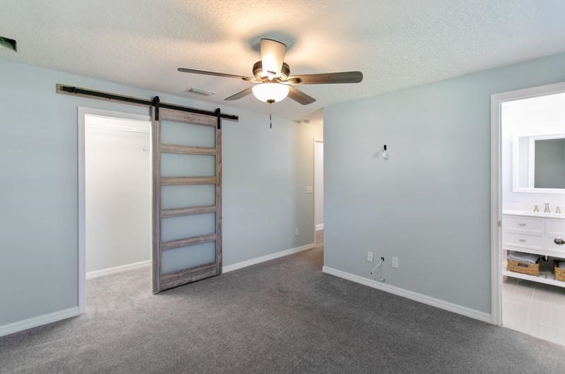 347 Lobelia Road St. Augustine, FL 32086 - Photo 14 of 40 an empty room with closet and a ceiling fan