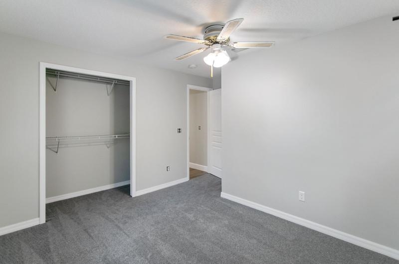 347 Lobelia Road St. Augustine, FL 32086 - Photo 19 of 40 a view of an empty room with a chandelier fan