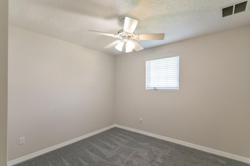 347 Lobelia Road St. Augustine, FL 32086 - Photo 21 of 40 an empty room with a window and a fan